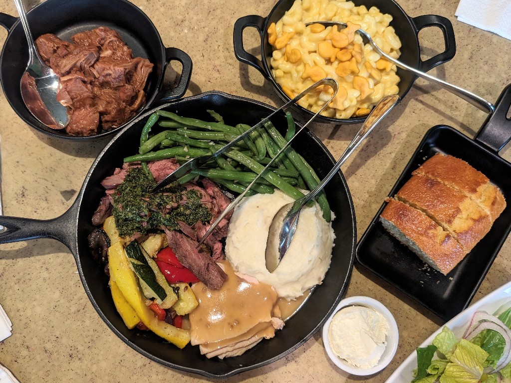 Cast iron style pans full of food make a hidden Mickey at Garden Grill