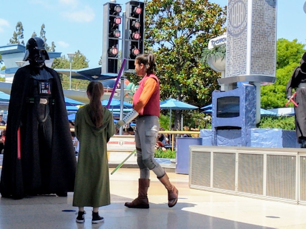 Disneyland Jedi Training is a live show where Star Wars fans can become a Jedi. Find out how to register and tips to prep your kids to fight the Dark Side. #disneyland #starwars #jeditraining