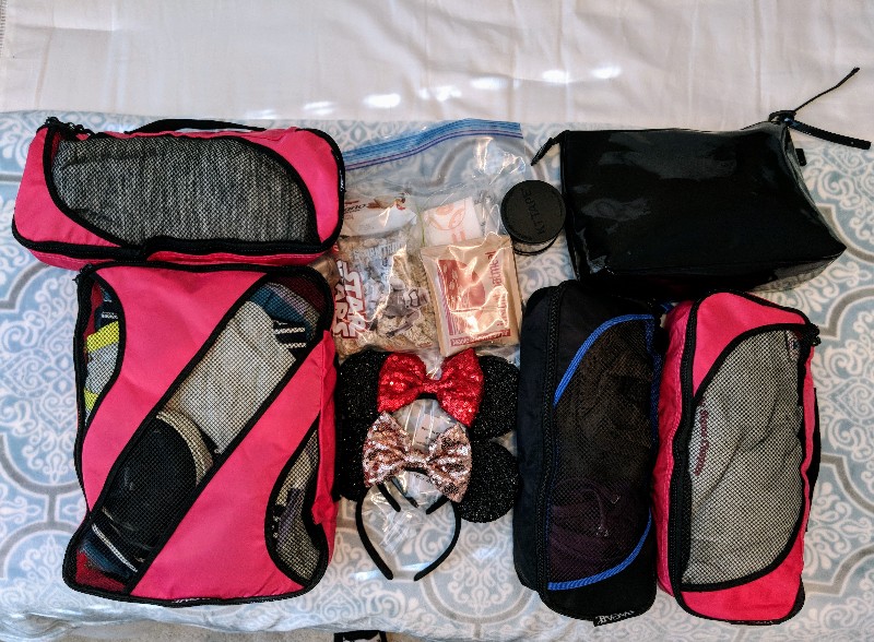 Are you heading to Disney for a short visit? Then I challenge you to pack light for Disney World using my tested tips. They even work for runDisney trips! #rundisney #disneypacking #disneyworld #packing