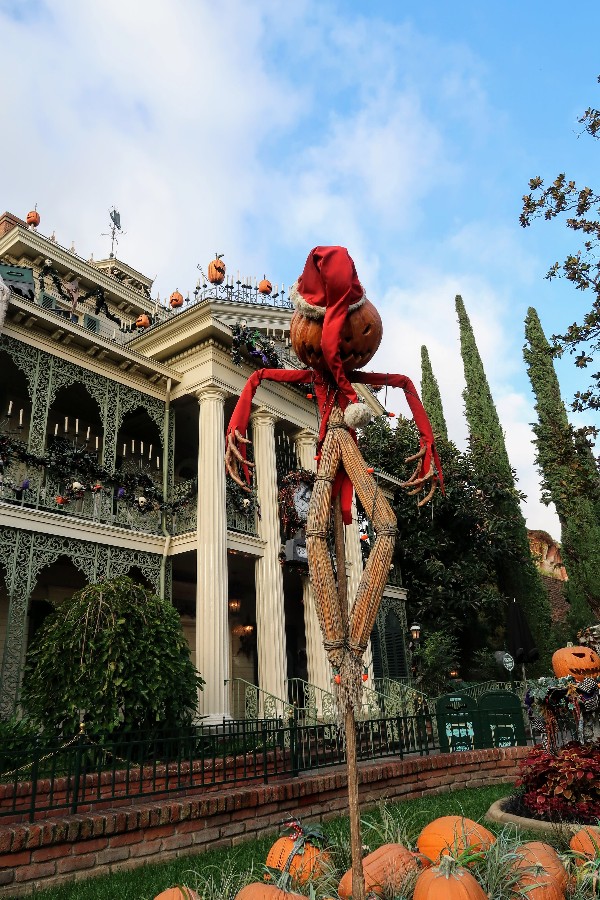 Is visiting Disneyland at Christmas on your wish list? If so, find out what you need to see and what you can skip during the holidays at Disneyland. #disneyland #hauntedmansionholiday #disneylandchristmas #itsasmallworld #disneyvacation