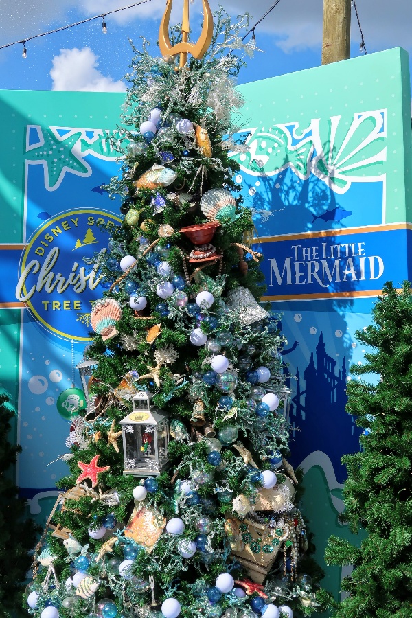 The Disney Springs Christmas Tree Trail at Disney World is a fun and free way to get in the Christmas spirit. Find out more about this seasonal event. #disneysprings #disneyworld #disneychristmas #disney #christmas