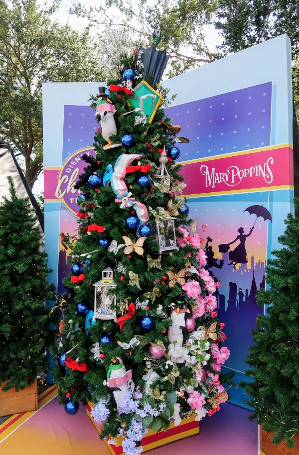 The Disney Springs Christmas Tree Trail at Disney World is a fun and free way to get in the Christmas spirit. Find out more about this seasonal event. #disneysprings #disneyworld #disneychristmas #disney #christmas