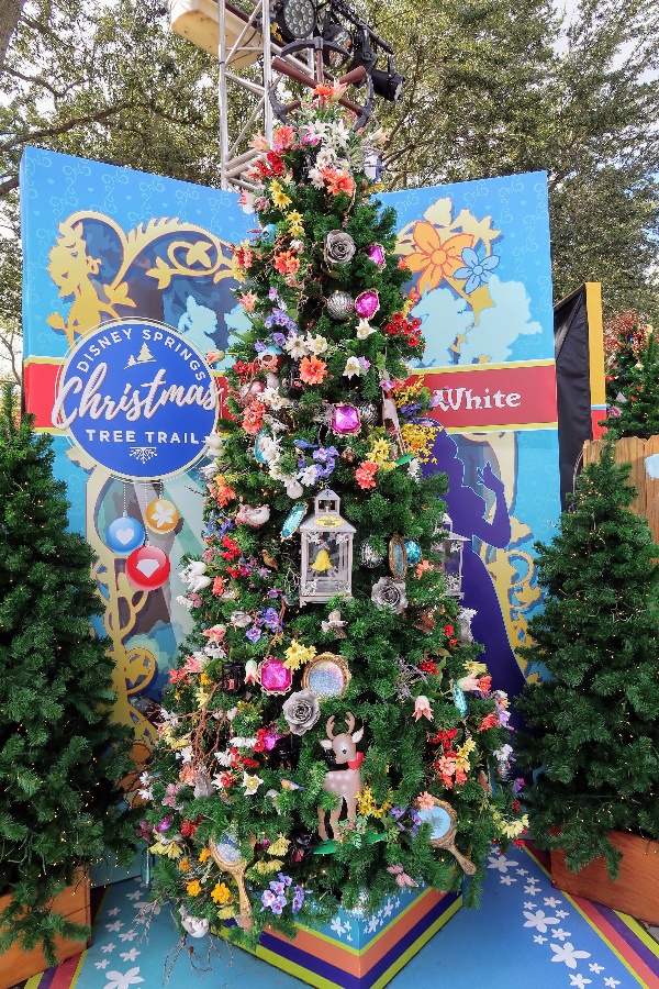 The Disney Springs Christmas Tree Trail at Disney World is a fun and free way to get in the Christmas spirit. Find out more about this seasonal event. #disneysprings #disneyworld #disneychristmas #disney #christmas