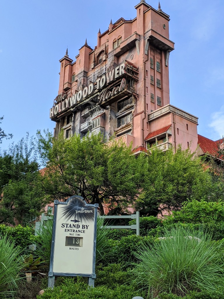 The iconic Tower of Terror looms over Hollywood Studios in the bright sunshine