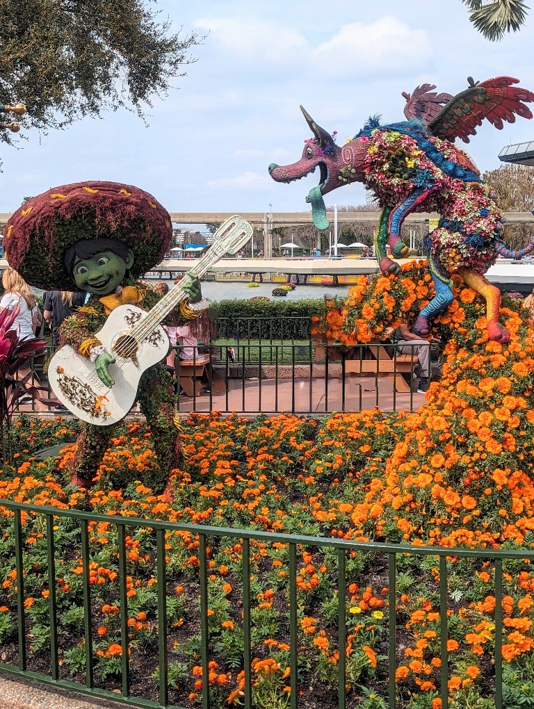 New Miguel and Dante topiaries on a marigold path at Flower and Garden