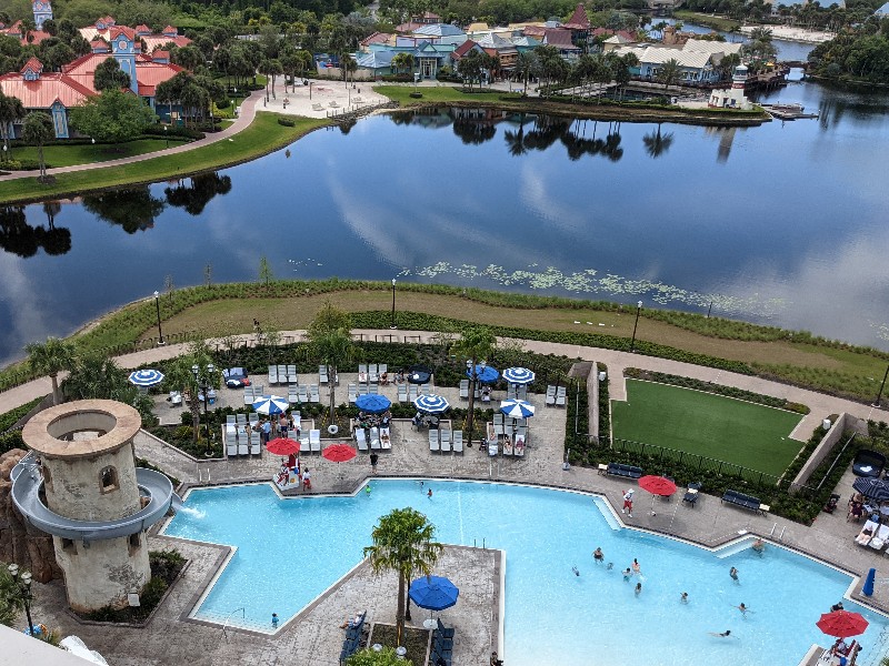 View of Riviera pool and lake beyond. Take a tour of our Disney's Riviera Resort 1 bedroom villa which is a sophisticated take on the usual Disney World resort experience. #disneysrivieraresort #disneyworld