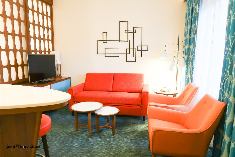 Cabana Bay Beach Resort Family Suite living room with fold out couch and two side chairs.