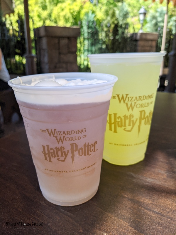 Frozen butterbeer at Three Broomsticks outdoor dining patio. Although still magical, the Wizarding World of Harry Potter during COVID has several changes that you need to know when planning your trip.