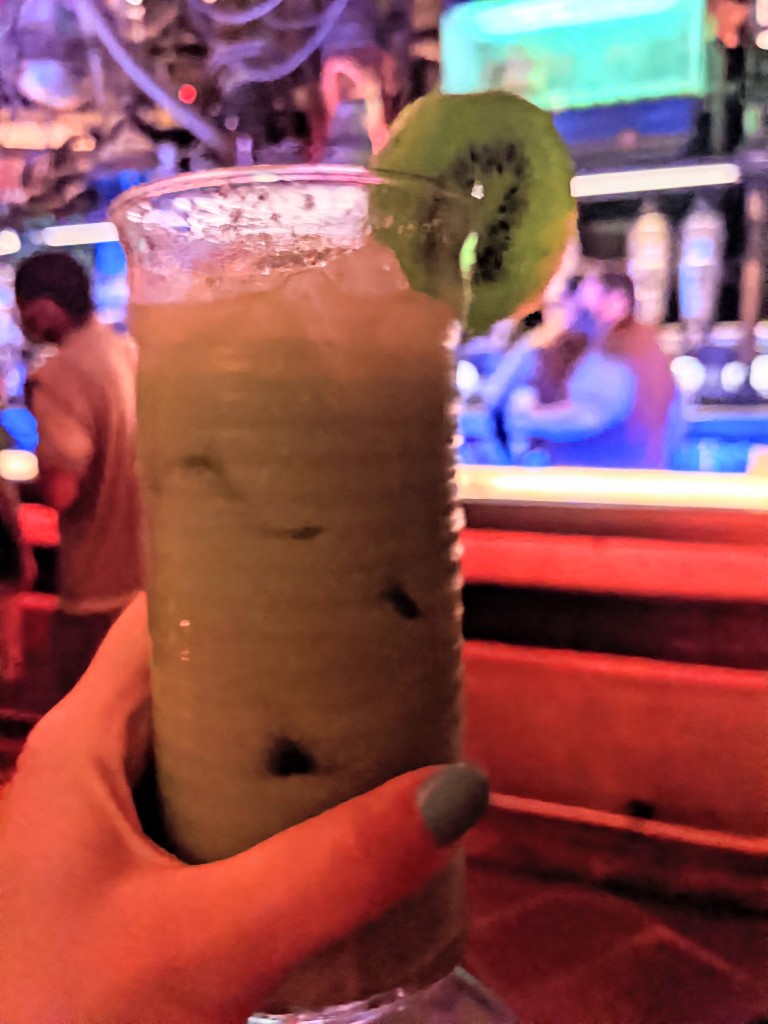 T-16 Skyhopper at Oga's Cantina is a creamy-looking green drink with kiwi garnish 