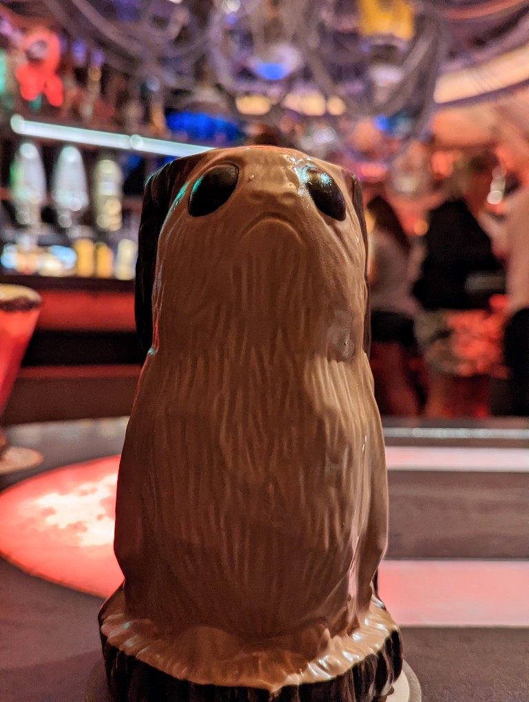 A porg mug looks out at guests from a table at Oga's Cantina in Galaxy's Edge
