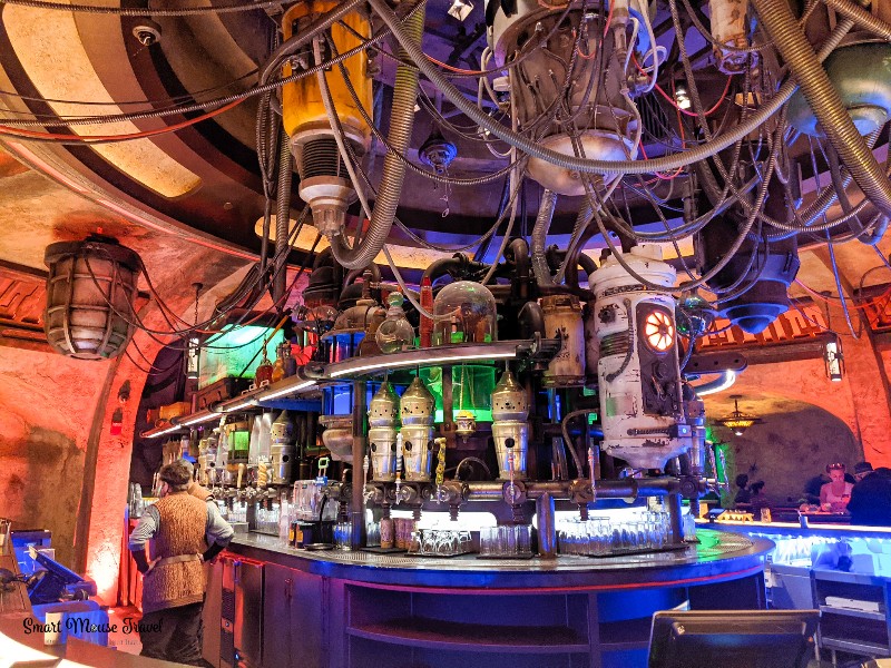 Hanging pipes, colorful jars behind the bar at Oga's Cantina in Galaxy's Edge.