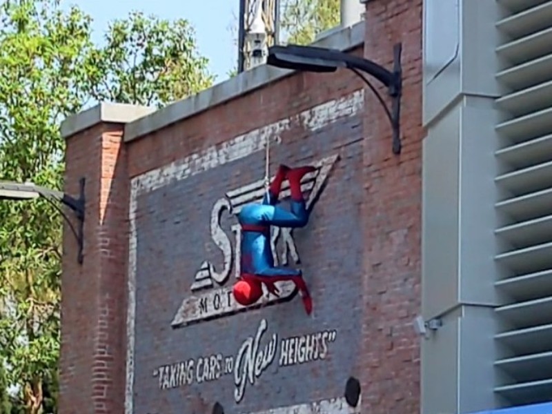 Spider-Man crawling down a wall during The Amazing Spider-Man show.