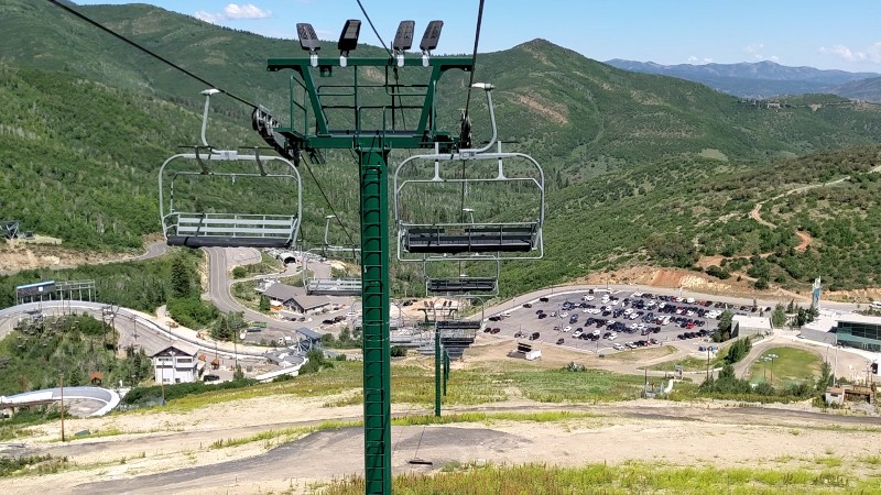 Chairlift with view of mountain in the background.