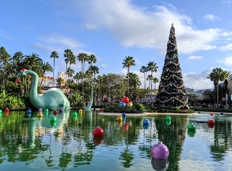 Echo Lake at Disney's Hollywood Studios with a giant Christmas tree and Gertie the Dinosaur in a Santa hat