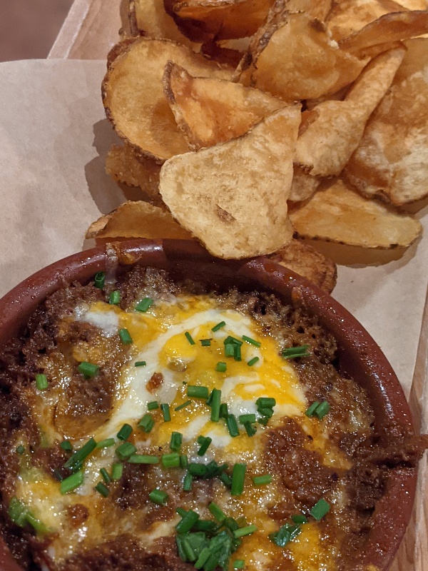 Geyser Point Bar and Grill cheesy BBQ brisket dip with fresh potato chips.