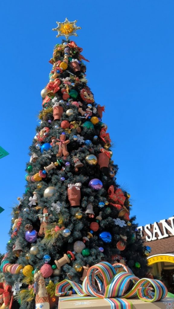 Disney Springs tree with gingerbread men and bright garland