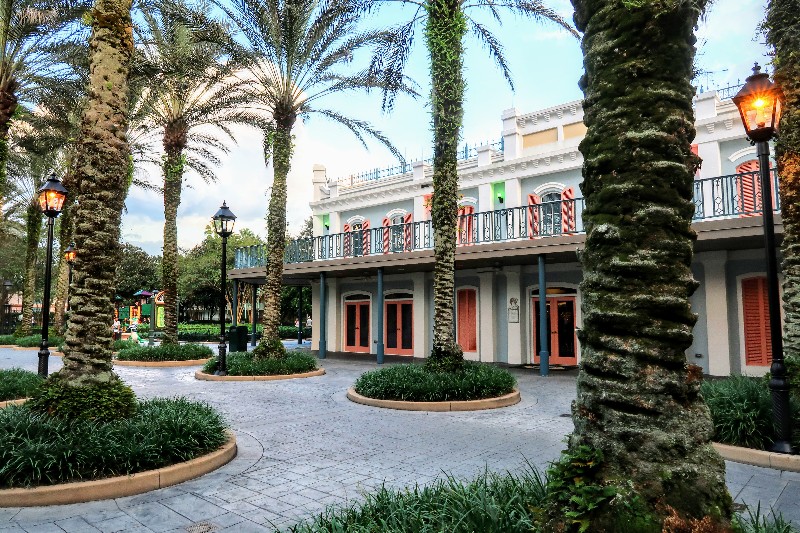 Brightly colored New Orleans inspired buildings with wrought iron railings at Port Orleans French Quarter