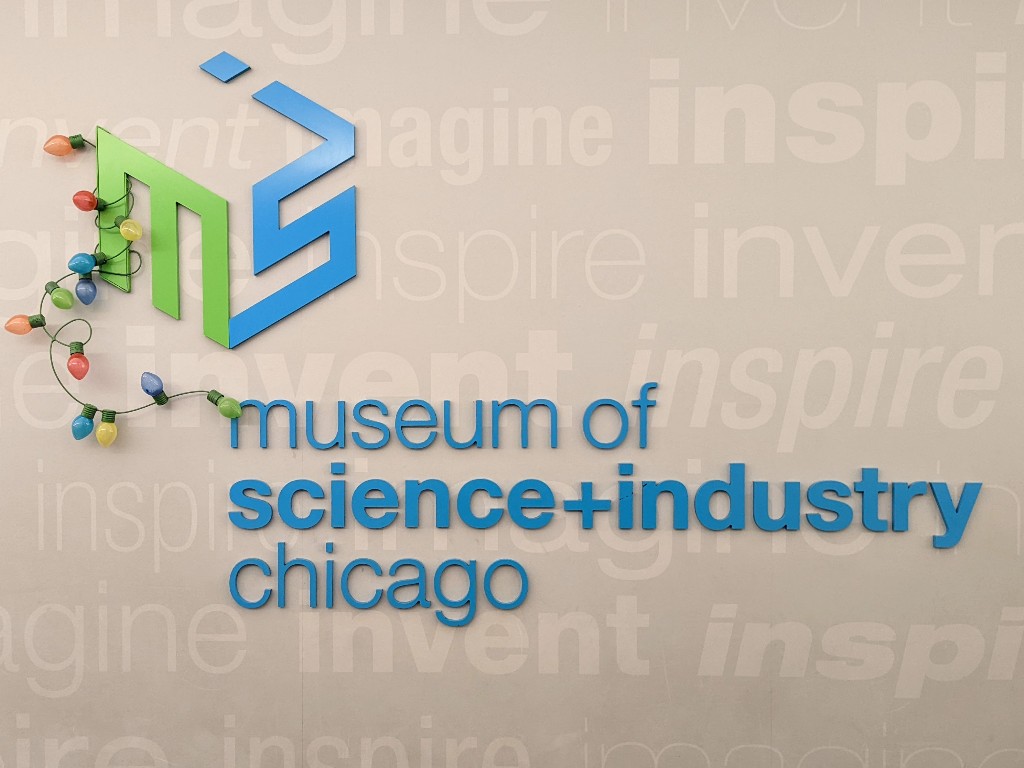 Museum of Science and Industry logo wrapped in colorful Christmas lights