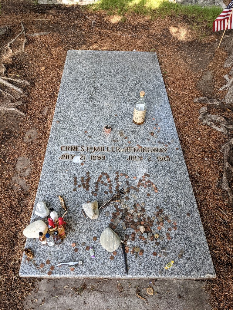 Ernest Hemmingway headstone between two spruce at Ketchum Cemetery