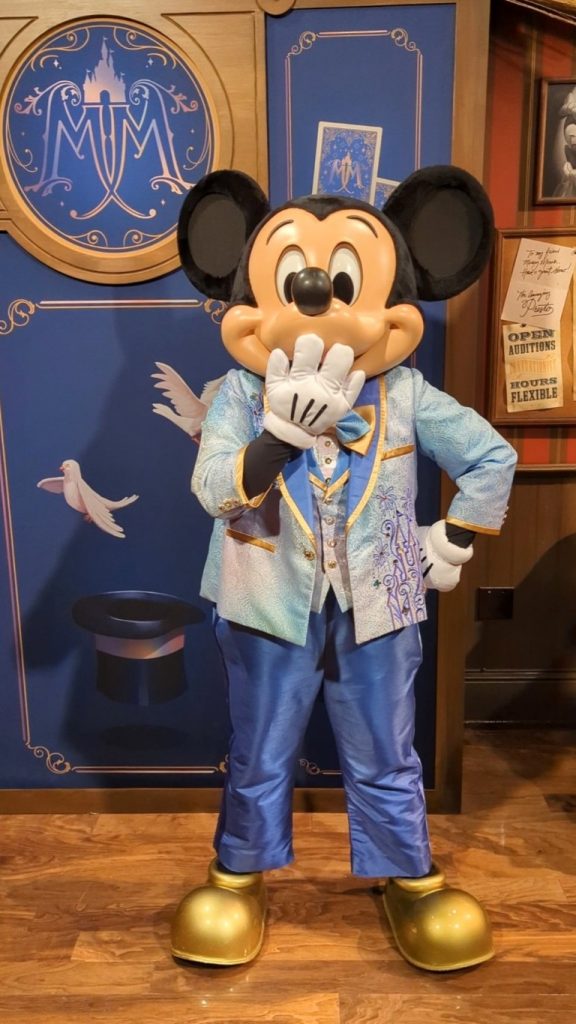 Mickey excitedly greets guests at Magic Kingdom