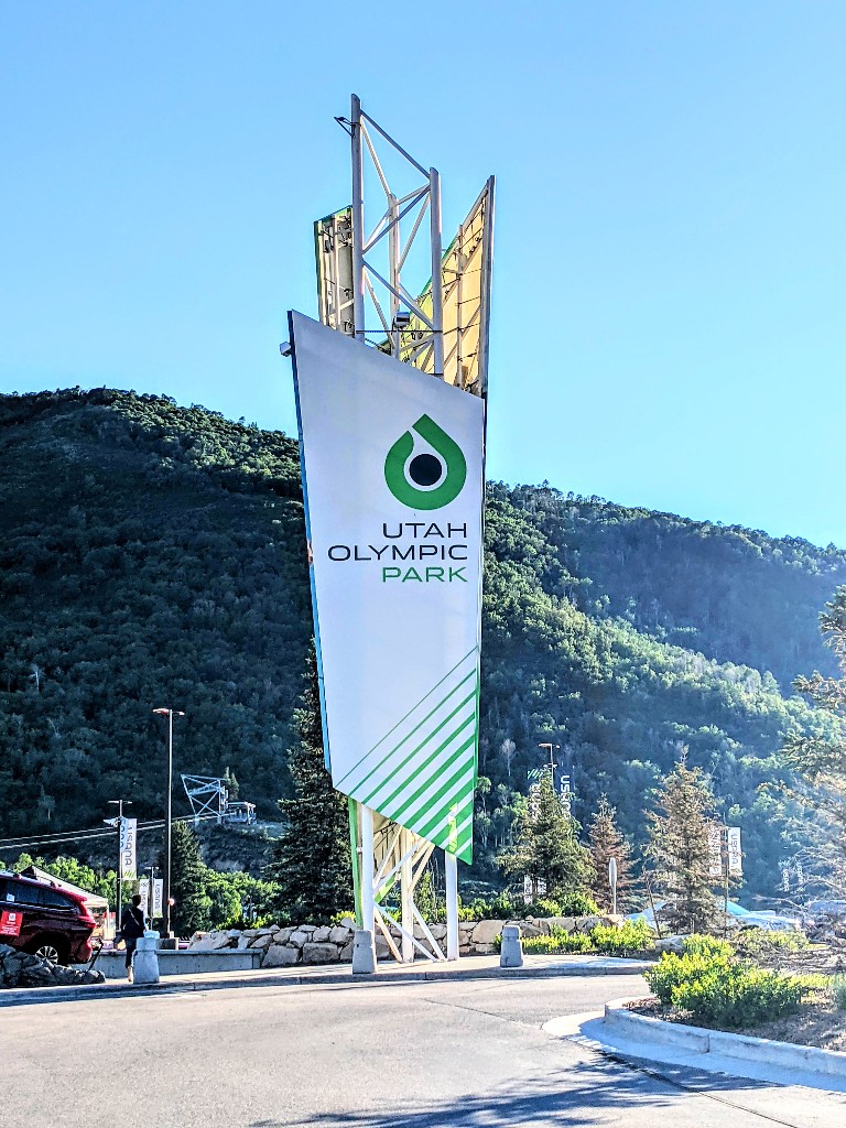 A large sign welcomes visitors to Utah Olympic Park in Park City, Utah