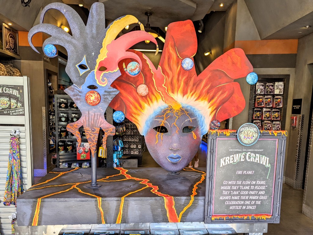 Volcano and lava inspired Mardi Gras masks represent the Fire Planet display