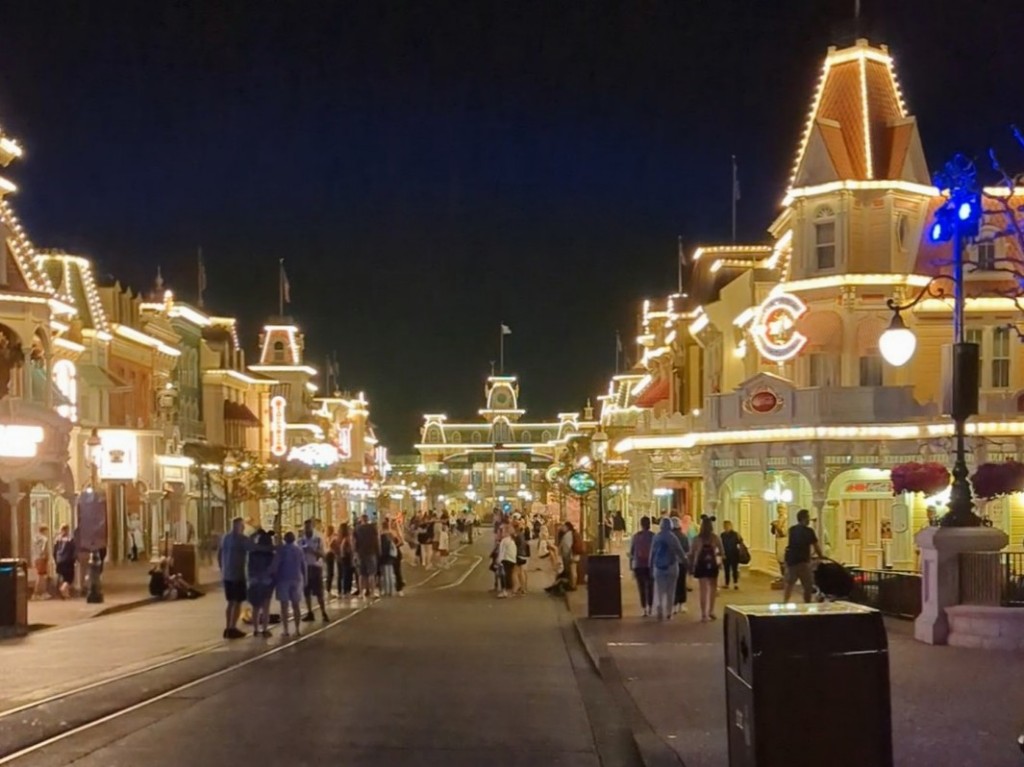 People loitering on Main Street near the end of Magic Kingdom extra evening hours