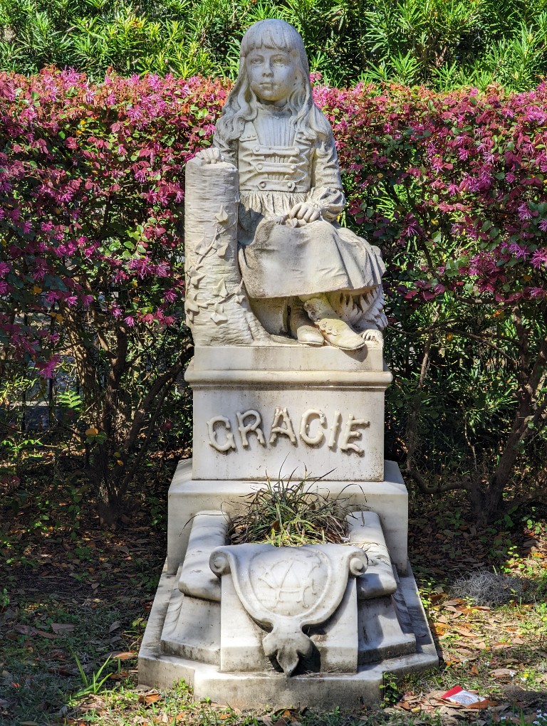 A famous headstone of a intricately carved girl at Bonaventure Cemetery outside Savannah