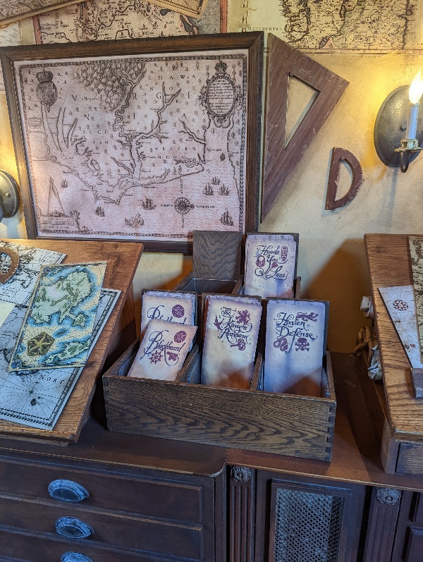 A rack of maps sit on a worn wooden chest in the enrollment center