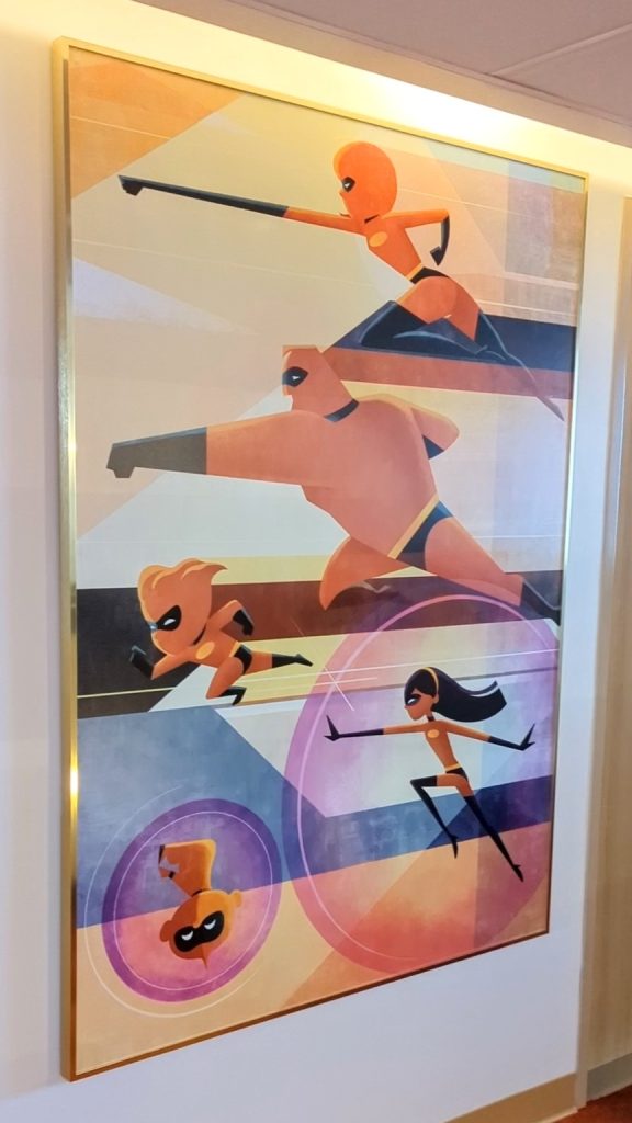 The Incredibles pose in a large portrait outside the Contemporary Resort Main Tower rooms