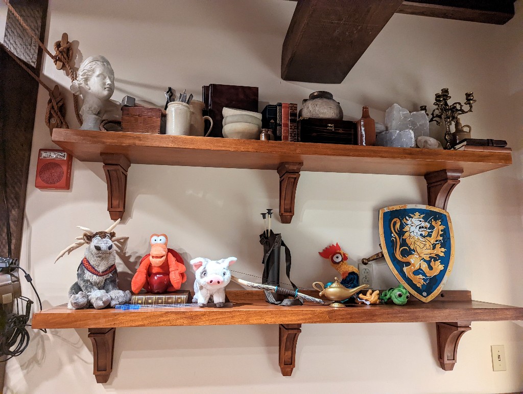 Stuffed animals and other props on the shelf at Sir Mickey's Photo Studio