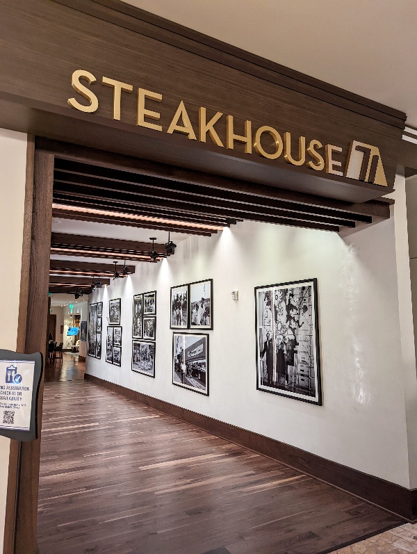 The entrance of Steakhouse 71 off the lobby of Disney's Contemporary Resort leads to a fabulous meal and cocktail