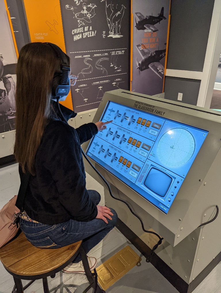 A girl uses an interactive display at St Simons World War II on the Home Front Museum