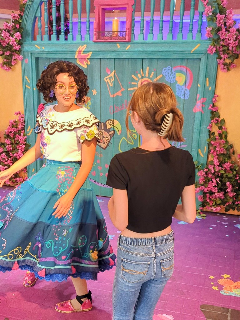 Mirabel greets a girl at Disney California Adventure