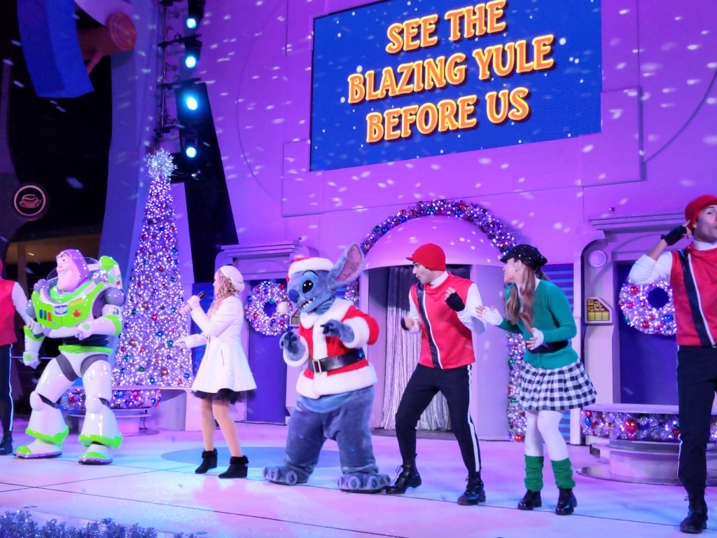 Stitch and Buzz Lightyear get Mickey's Very Merry Christmas Party guests up and dancing