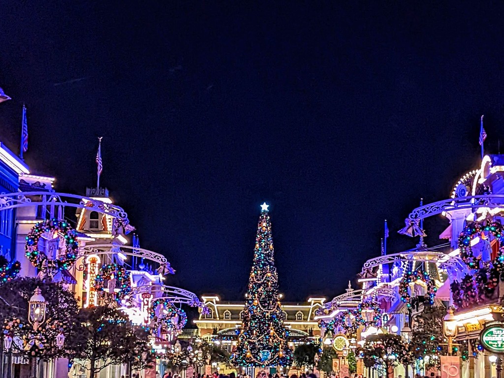Colorful lights, wreaths, and a giant Christmas tree turn Magic Kingdom into a winter wonderland
