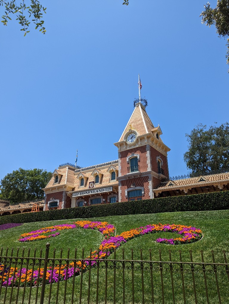 Disneyland train station with colorful flowers when entering Disneyland Park