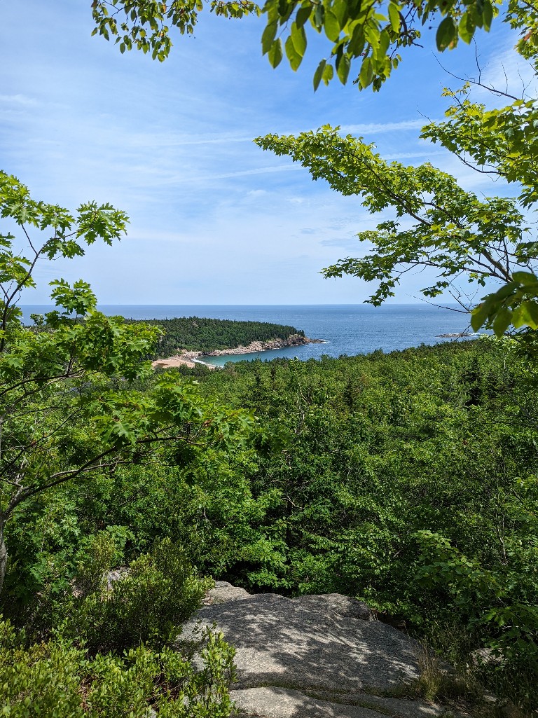 Beautiful views of Sand Beach from Acadia National Park Beehive Loop Trail