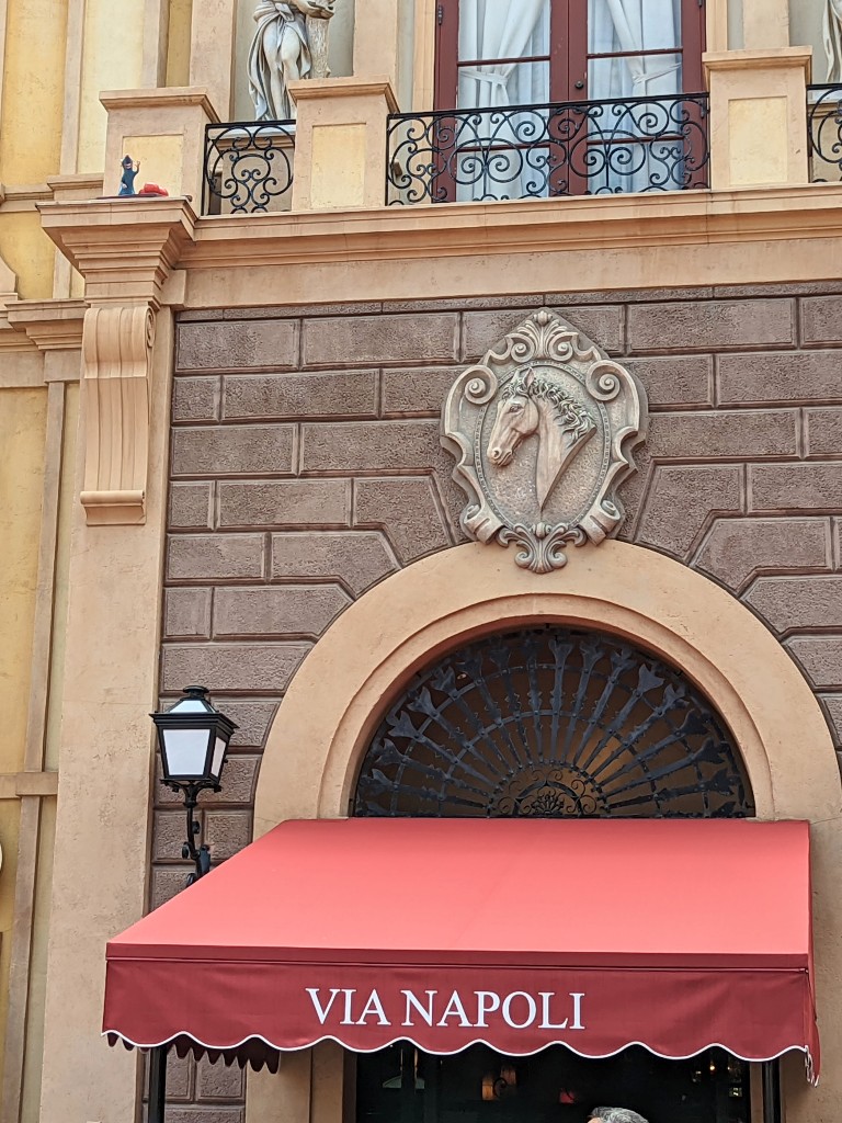 Look high above Via Napoli's awning to find Remy in Italy
