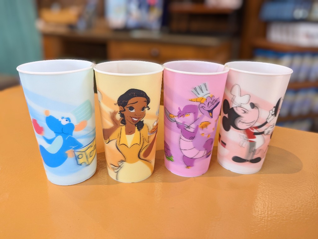 Remy, Tiana, Figment, and Mickey cups sit on a counter