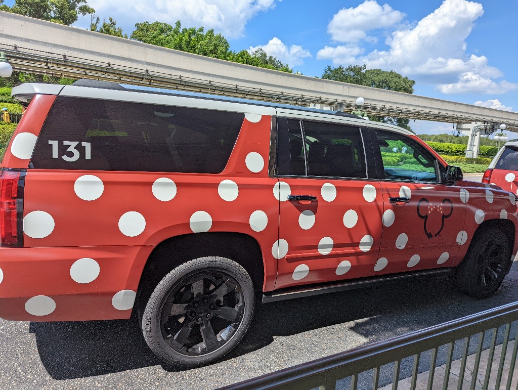 A red vehicle with white polka dots is easily identified as a Minnie Van