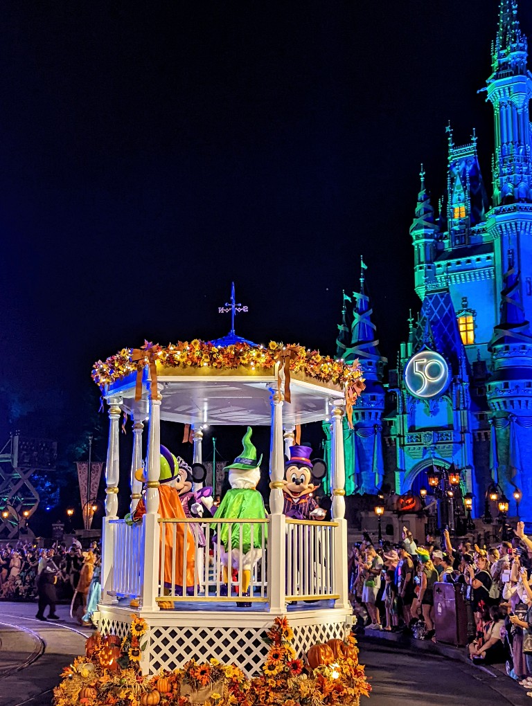 Mickey waves to guests during Mickey's Boo To You Parade at MNSSHP