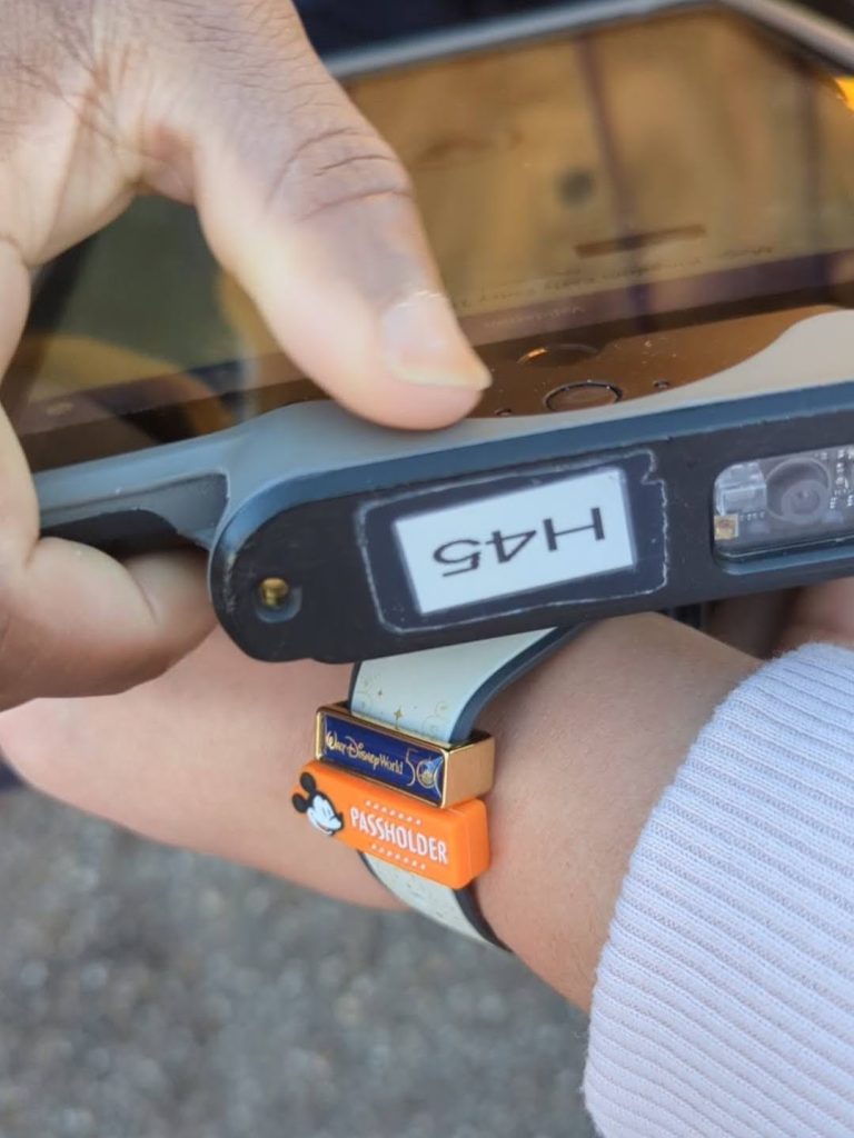 A cast member scans my MagicBand for Disney World Early Theme Park Entry