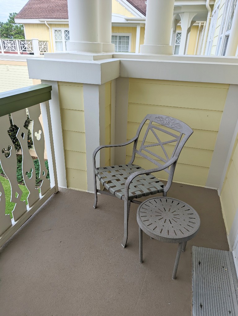 Two wrought iron chairs and side table provide seating on the semi-private balcony