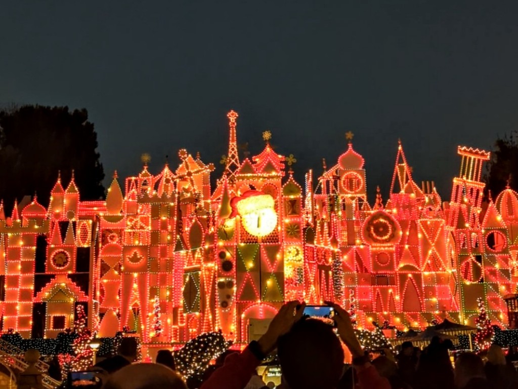 it's a small world Holiday covered in lights during Disneyland Christmas