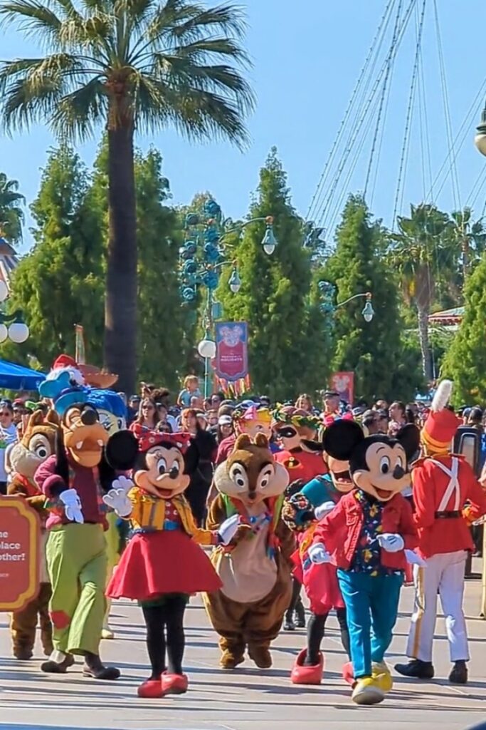 Mickey, Minnie, and friends walk through Disney California Adventure during Mickey's Happy Holidays