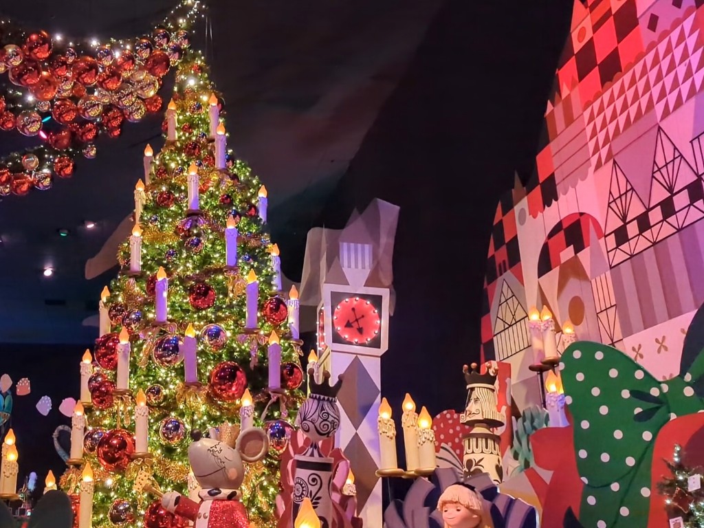 A beautifully decorated Christmas tree enhances it's a small world Holiday during Disneyland Christmas