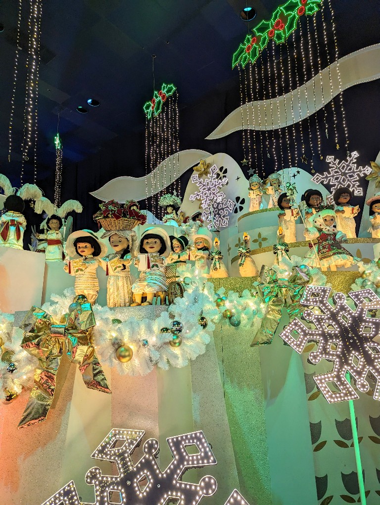 it's a small world Holiday is completely transformed with holiday decorations and twinkling lights