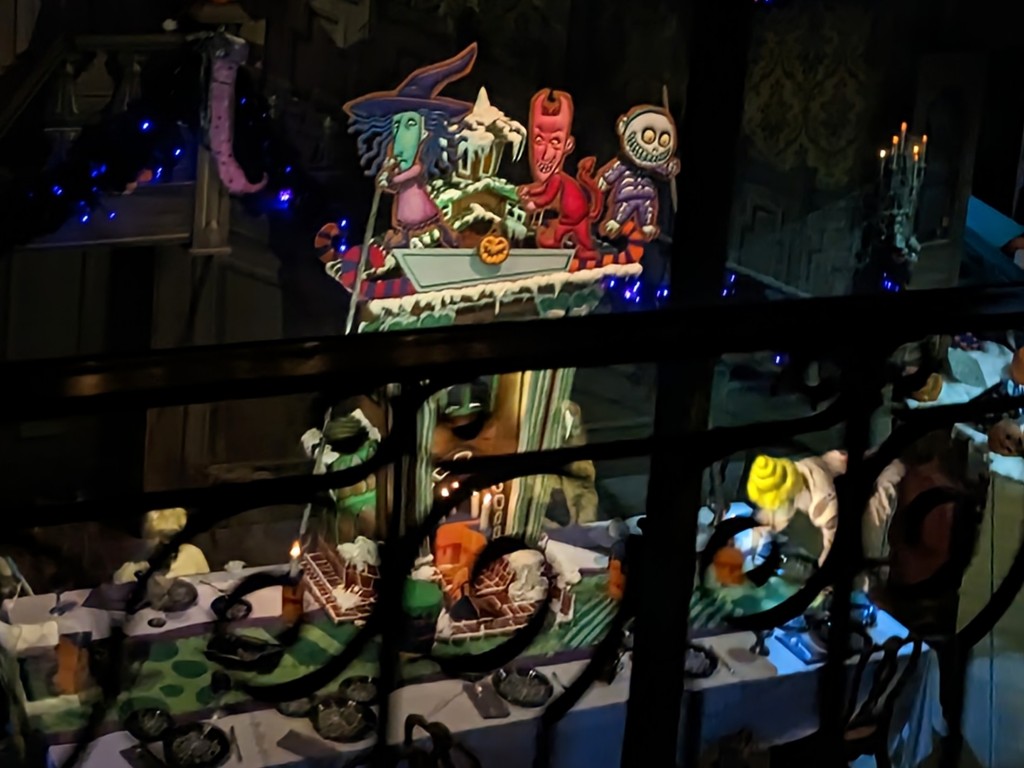 Lock, Shock, and Barrel are featured on the giant 2022 Haunted Mansion Holiday gingerbread house