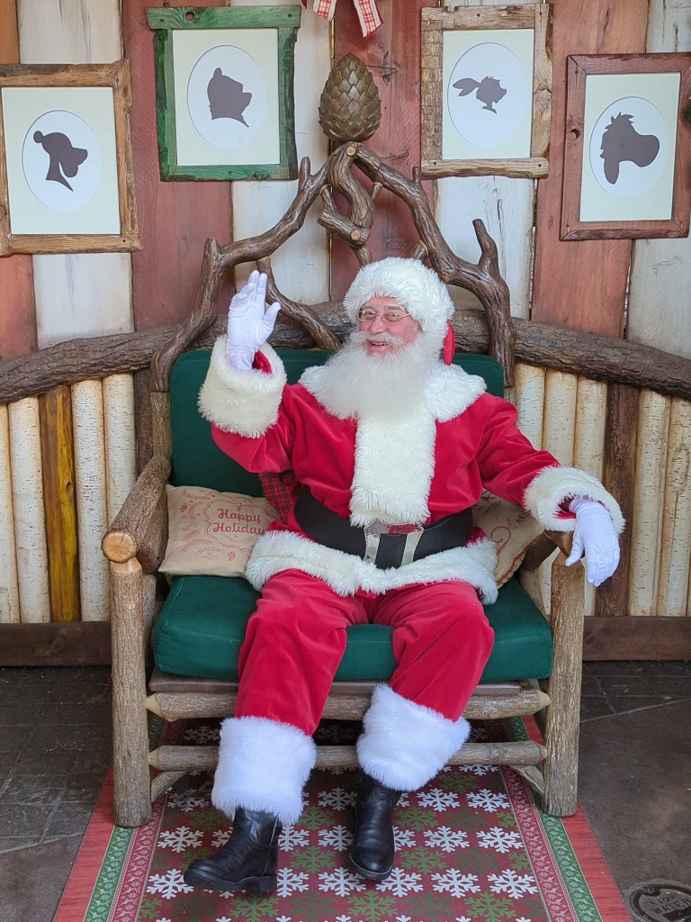Santa waves to waiting guests in Pooh's Thotful Spot.